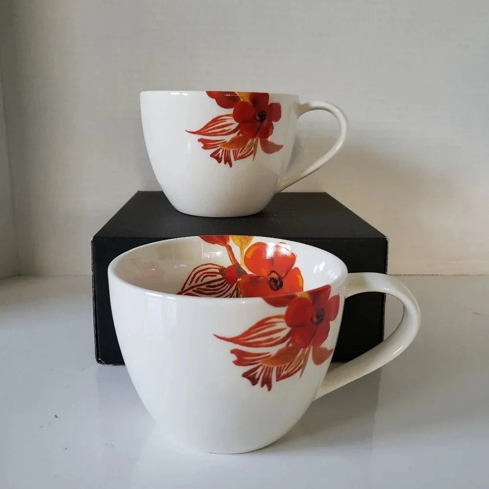 Starbucks 2008 set of 2 White/Orange/Red Poppy Flower Ceramic Coffee Mugs.